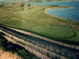 images/Golf-breaks/Warren/aerial-view-of-6th-green-with-lagoon-pano.jpg